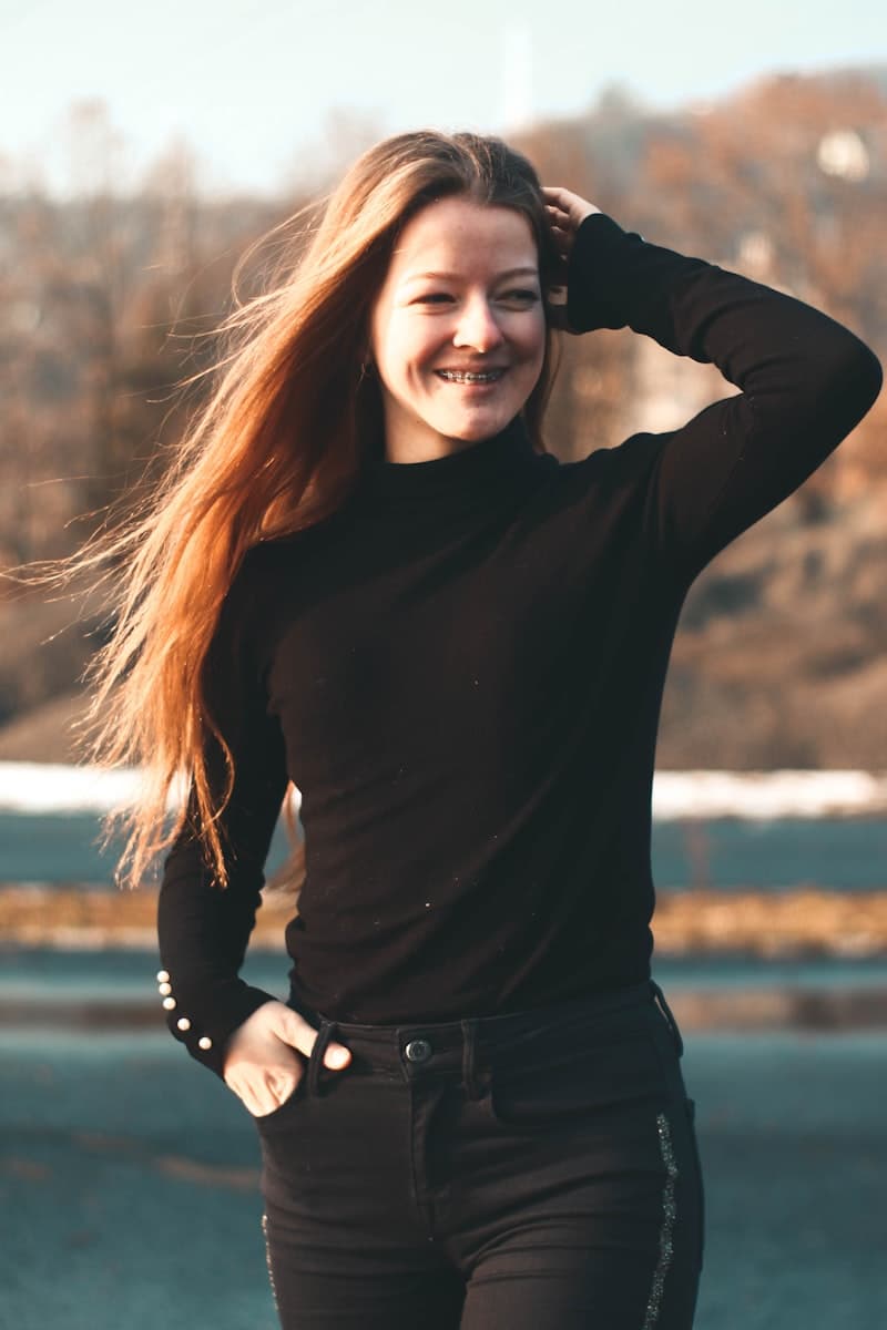 Confident woman smiling outdoors — weight loss journey